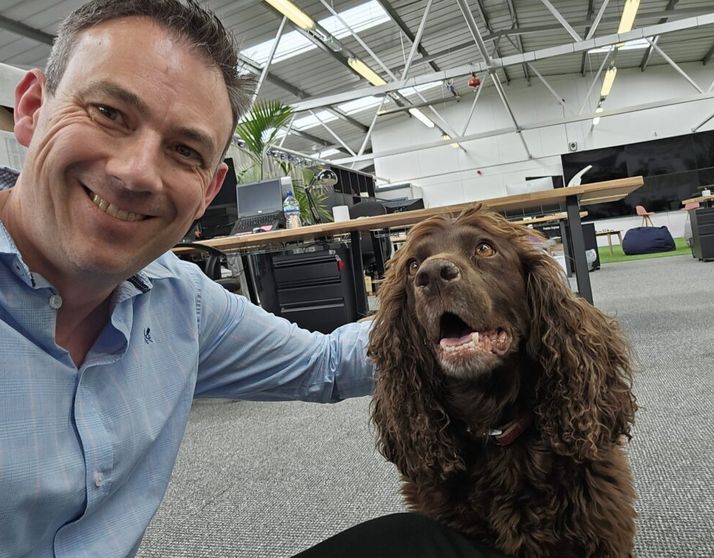 Paul Robson with office dog, Oakley